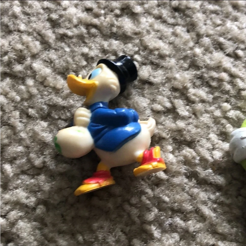 Vintage Disney action figures - daffy, minnie, and goofy